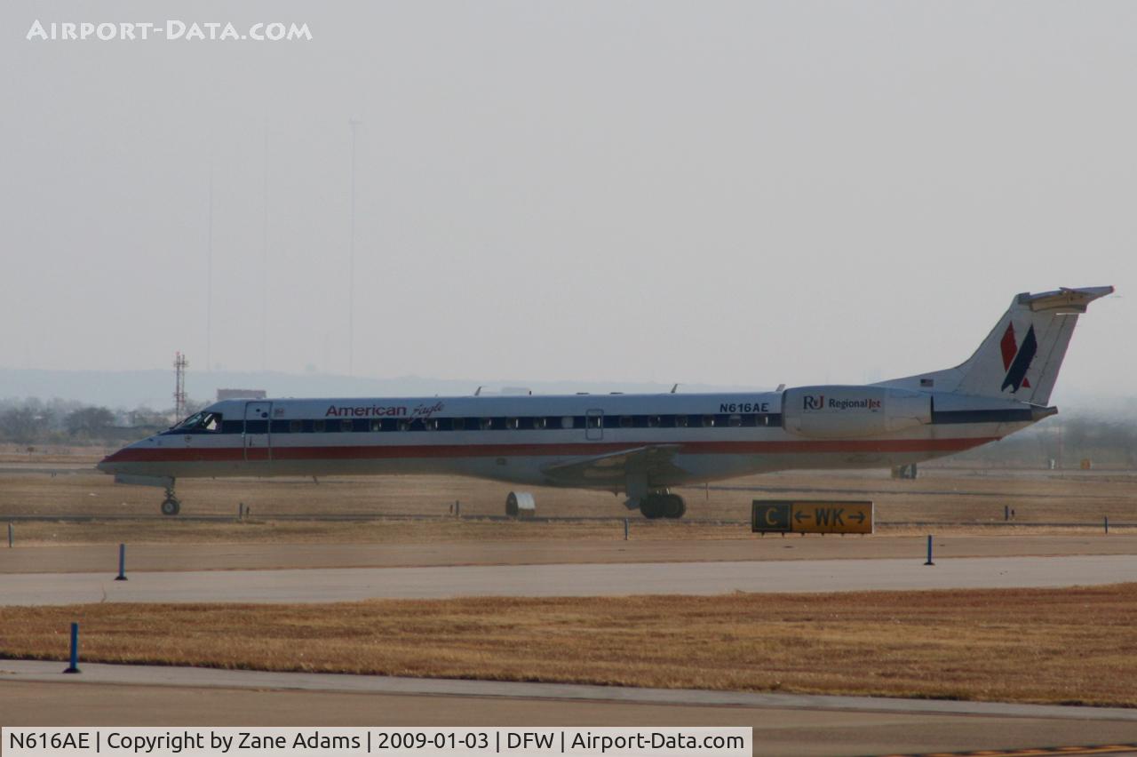 N616AE, 1998 Embraer ERJ-145LR (EMB-145LR) C/N 145092, American Eagle at DFW - sun wind and a ..grrrr.. fence.