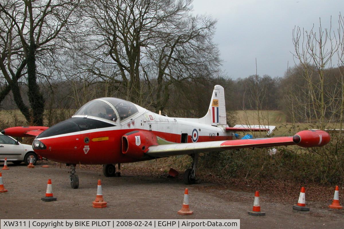 XW311, 1970 BAC 84 Jet Provost T.5 C/N EEP/JP/975, STORED IN THE CAR PARK AT POPHAM. WAS ORIGINALY TO BE DISPLAYED AT A LOCAL GARAGE BUT PLANNING PERMISSION WAS NOT GRANTED.