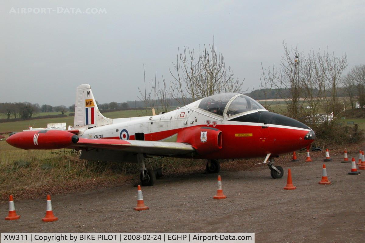XW311, 1970 BAC 84 Jet Provost T.5 C/N EEP/JP/975, STORED IN THE CAR PARK AT POPHAM. WAS ORIGINALY TO BE DISPLAYED AT A LOCAL GARAGE BUT PLANNING PERMISSION WAS NOT GRANTED.