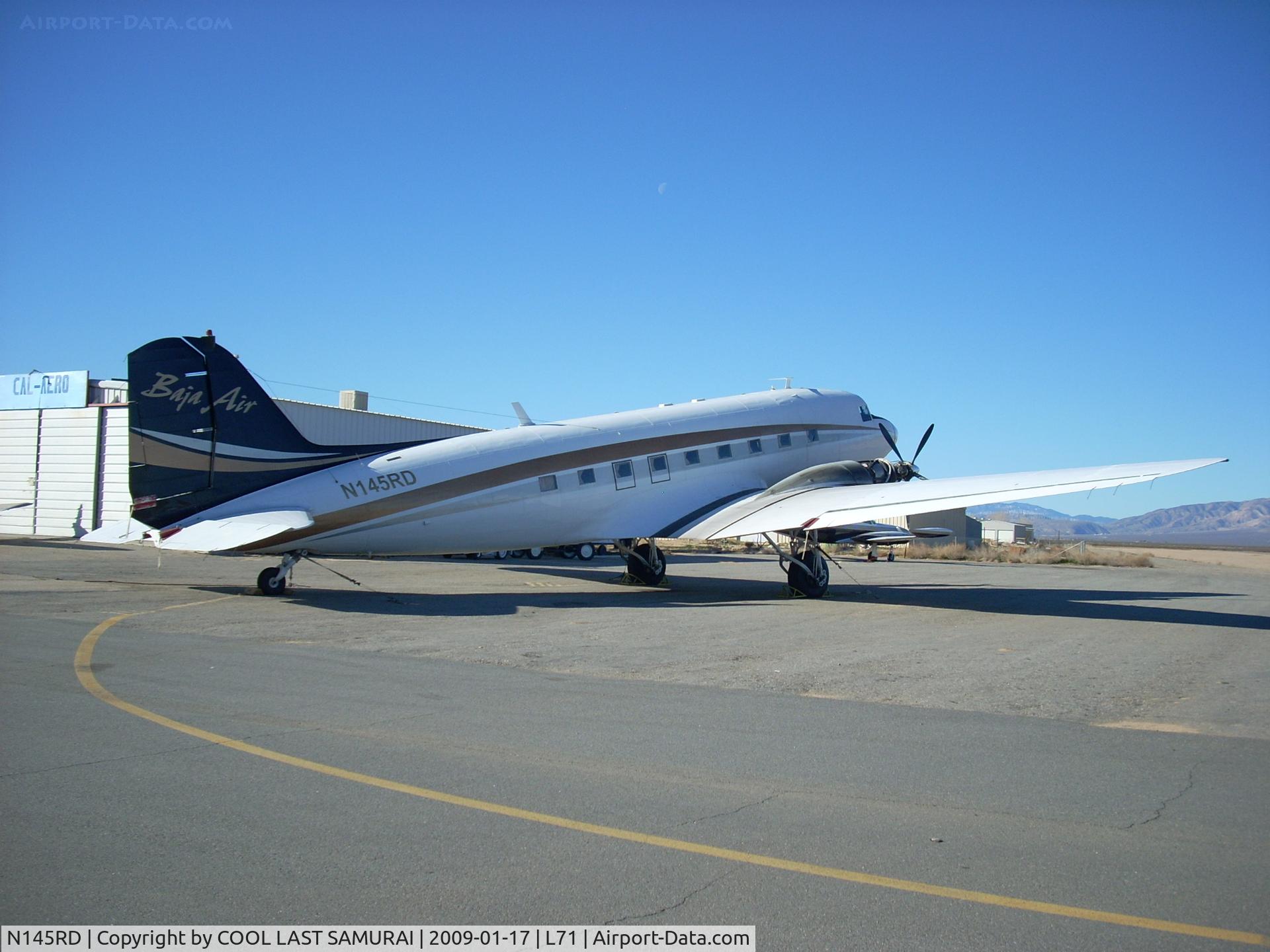 N145RD, 1942 Douglas DC-3-65TP (C-47A-90-DL) C/N 20175, seems to be having engine maintenance.