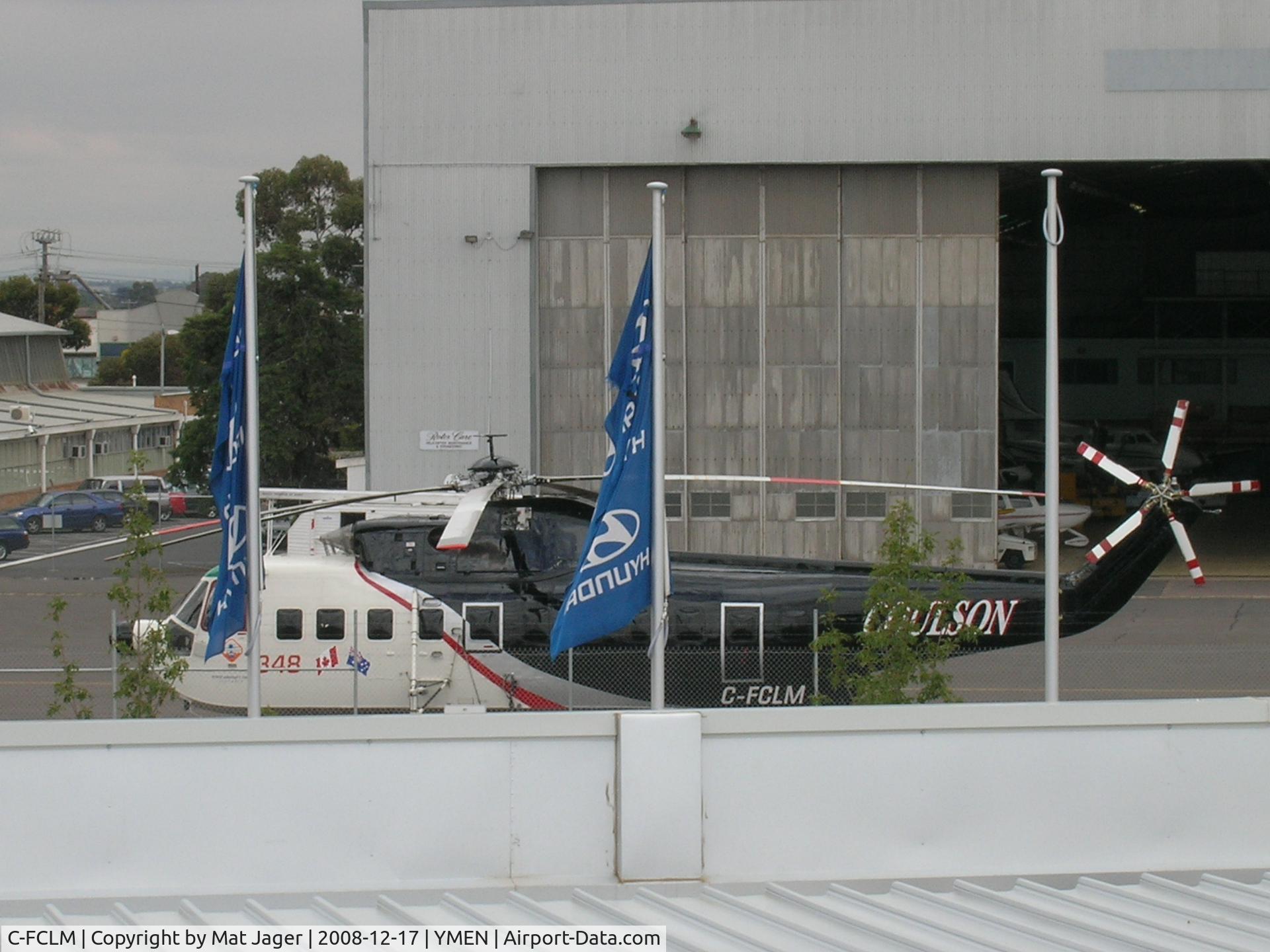 C-FCLM, 1972 Sikorsky S-61N C/N 61492, C-FCLM in front of Cirrus hanger, Ess. Airport. (Taken from roof of Essendon Chrylser dealership across the road.)