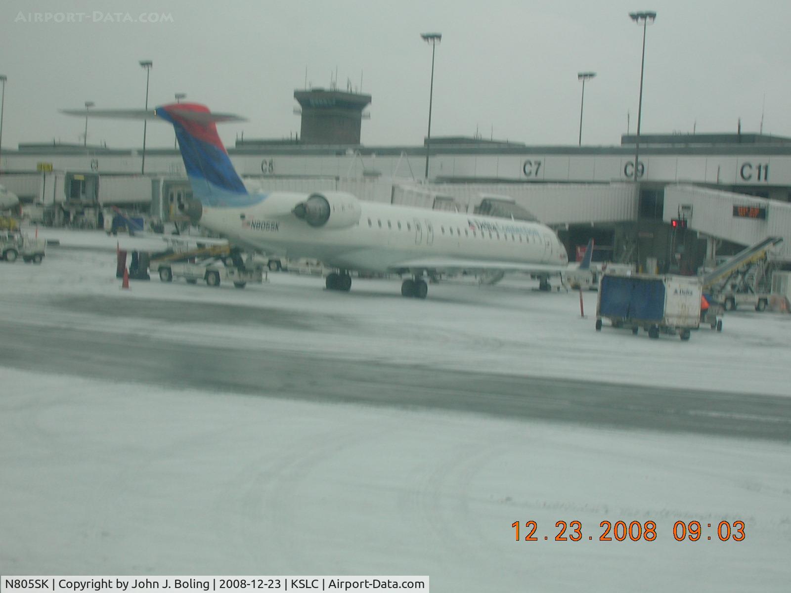 N805SK, 2006 Bombardier CRJ-900ER (CL-600-2D24) C/N 15069, On Gate at KSLC