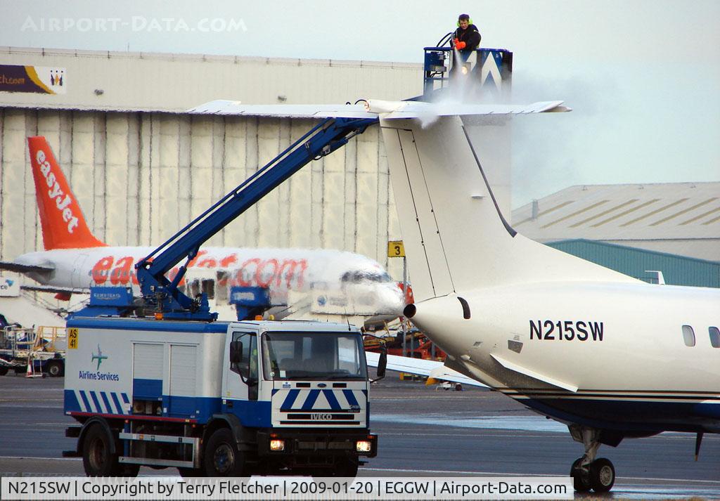 N215SW, 1993 Embraer EMB-120ER Brasilia C/N 120.281, Emb 120 on delivery gets the de-icer treatment before departure to Rome, Italy