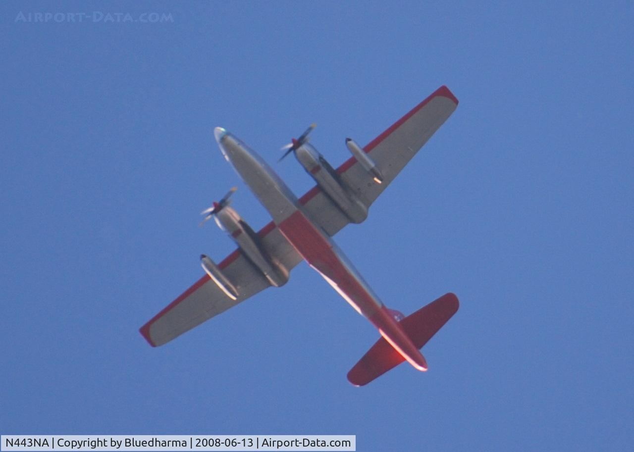 N443NA, 1958 Lockheed P2V-7 Neptune C/N 726-7168 (145906), Flying East over Columbine High School. My source tells me the 2 jet engines on the outboard pylon are used to get airborne when the temperature is high.