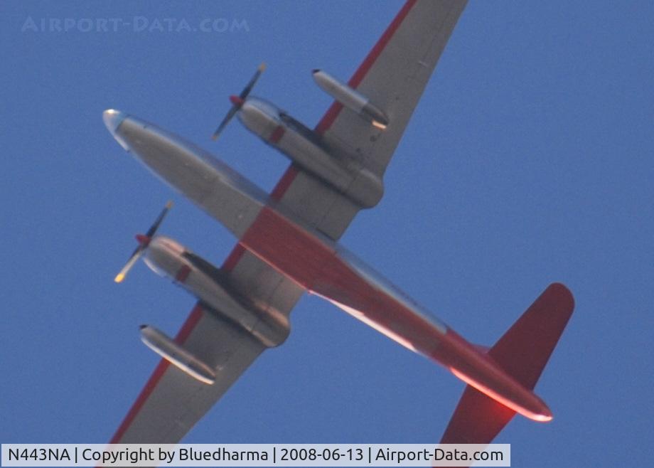 N443NA, 1958 Lockheed P2V-7 Neptune C/N 726-7168 (145906), Flying East over Columbine High School. My source tells me the 2 jet engines on the outboard pylon are used to get airborne when the temperature is high.
