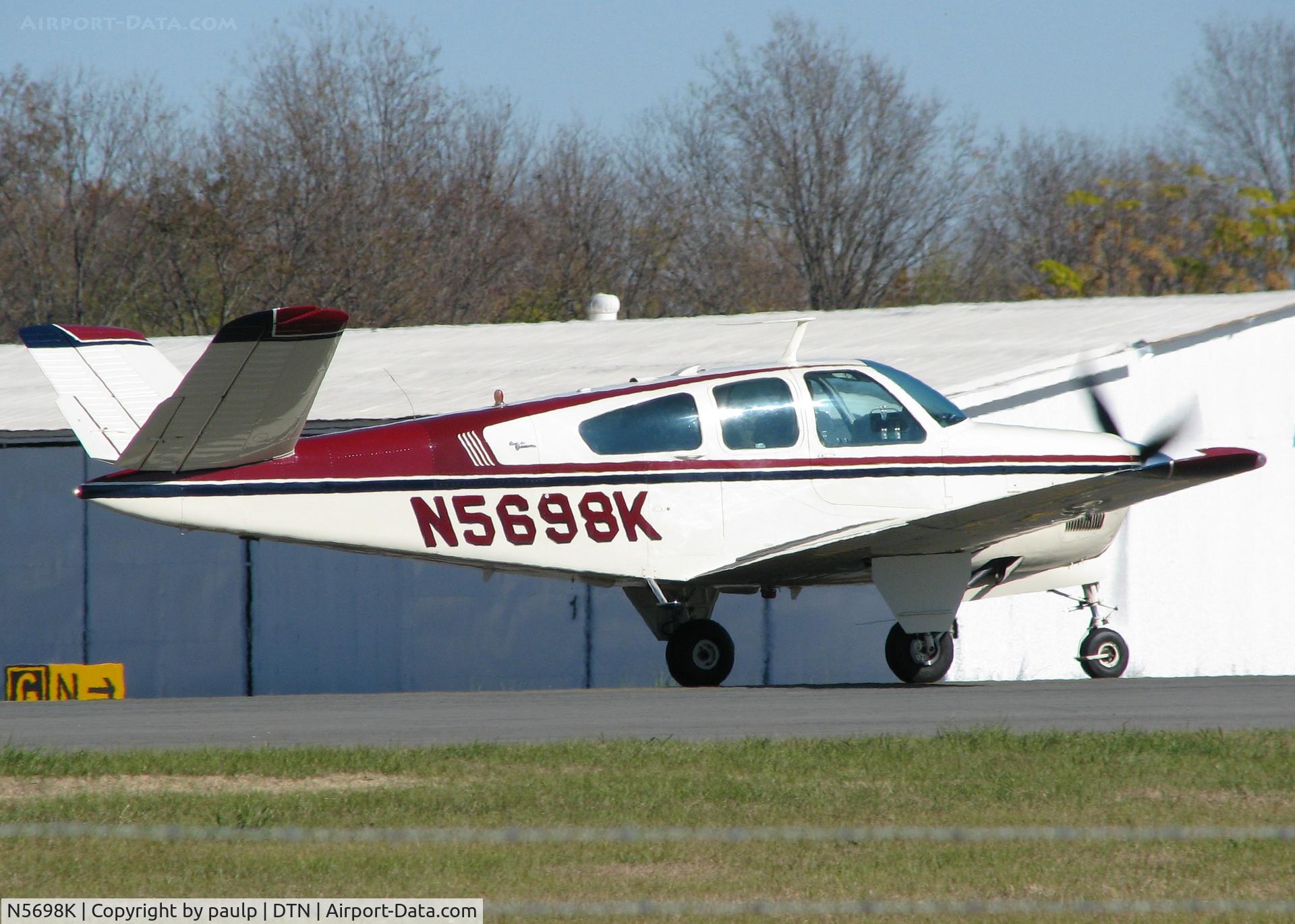 N5698K, 1964 Beech S35 Bonanza C/N D-7622, Taking off from Downtown Shreveport.