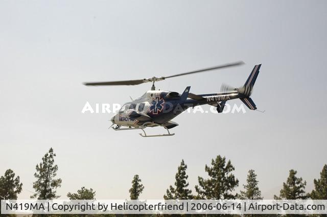N419MA, 1984 Bell 222UT C/N 47518, Settling down in the parking lot