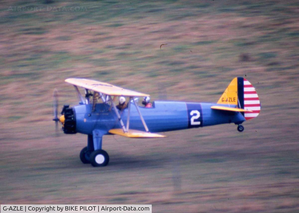 G-AZLE, 1940 Boeing E-75 C/N 75-8543, TAKING OF FROM IT'S FARM STRIP HOME NEAR ALDERSHOT HAMPSHIRE UK IN 1984. THIA A/C WAS SOLD BYE IT'S OWNER IN 1987 AND RE-AQUIRED IN 1993