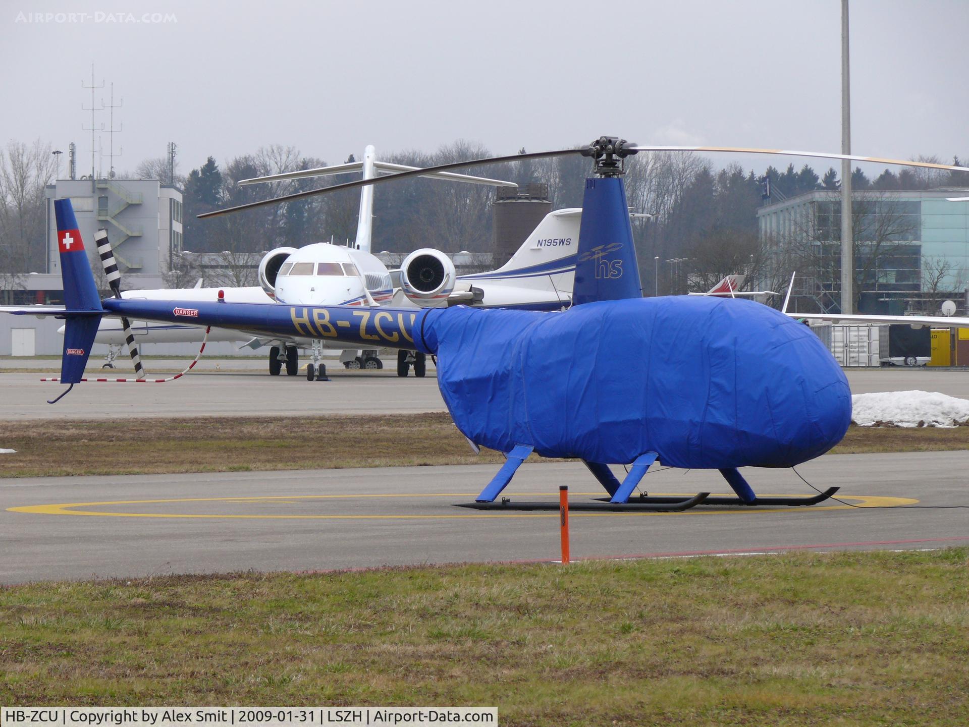 HB-ZCU, 2001 Robinson R44 Raven C/N 0968, Robinson R44 Raven HB-ZCU Heli Sittersdorf well wrapped up waiting for it's next trip to Davos