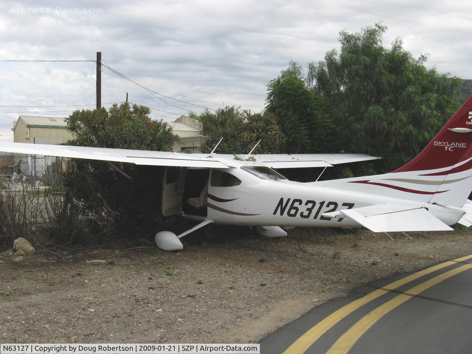 N63127, 2008 Cessna T182T Turbo Skylane C/N T18208883, 2008 Cessna T182T TURBO SKYLANE TC, Lycoming TIO-540-AK1A 235 Hp, landed long, fast and downwind on a bad day-Rwy 04 overrun into airport fence, student pilot/owner out-uninjured