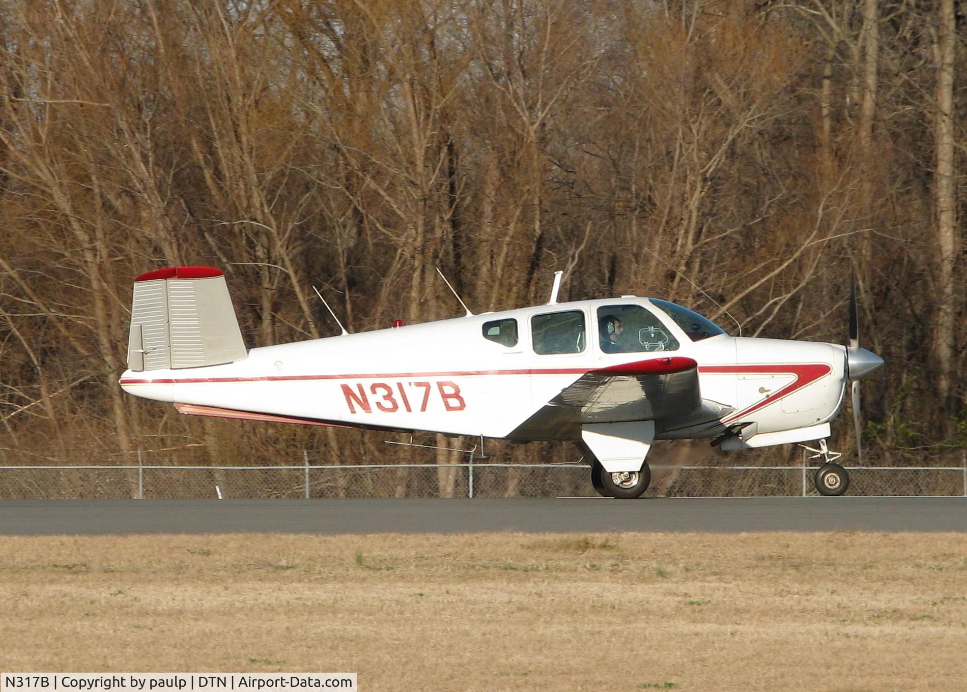 N317B, 1956 Beech G35 Bonanza C/N D-4816, About to take off from Downtown Shreveport.