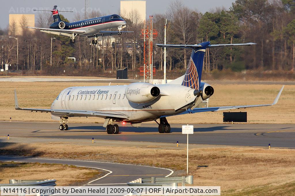 N14116, 2002 Embraer ERJ-145XR (EMB-145XR) C/N 145672, Continental Express (ExpressJet Airlines) N14116 (FLT BTA2901) taxiing to RWY 23 for departure to Houston Bush Intercontinental (KIAH), while US Airways Express (Chautauqua Airlines) N298SK (FLT CHQ3000) arrives from Philadelphia Int'l (KPHL).