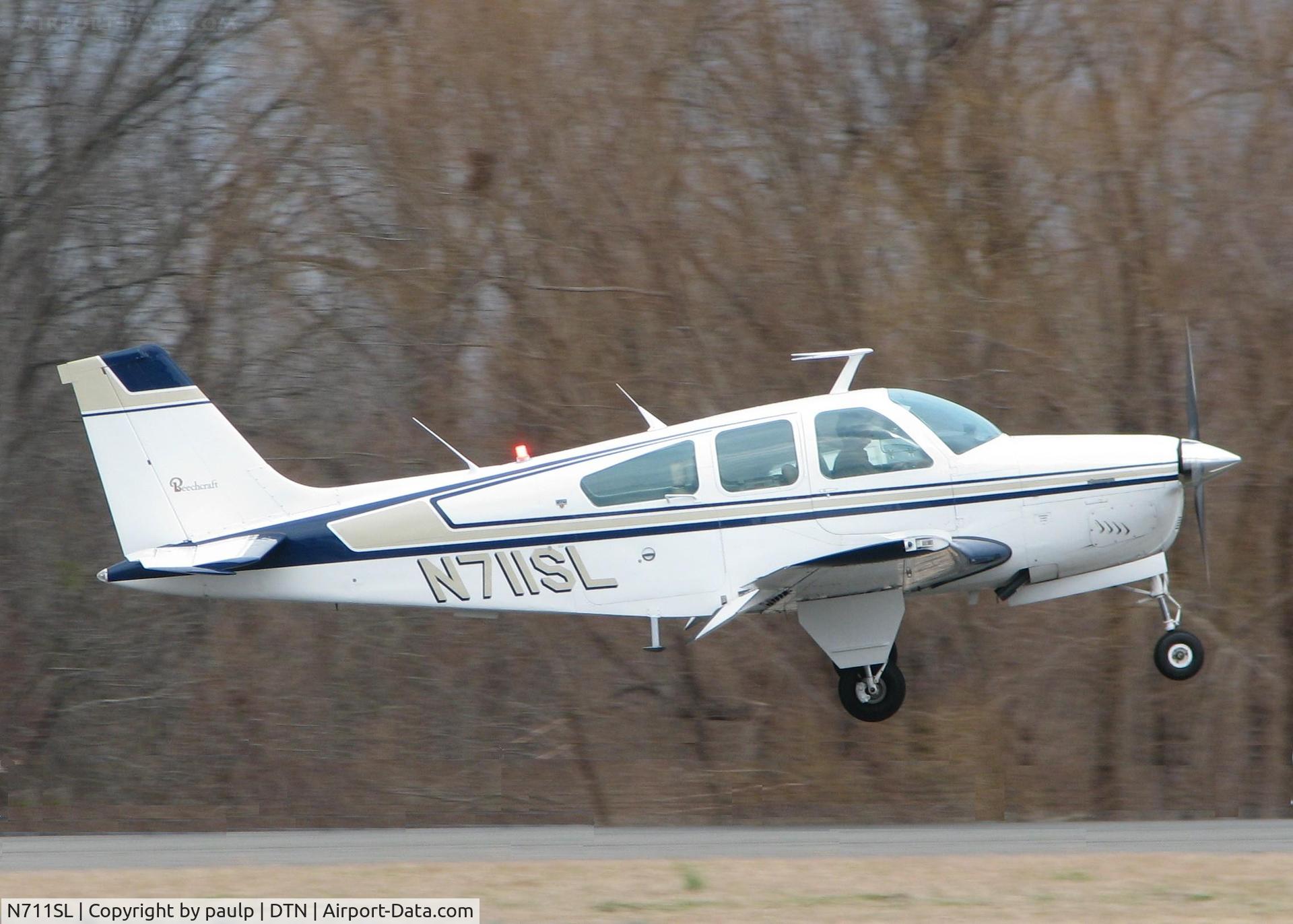 N711SL, 1978 Beech F33A Bonanza C/N CE-773, Touching down at Downtown Shreveport.