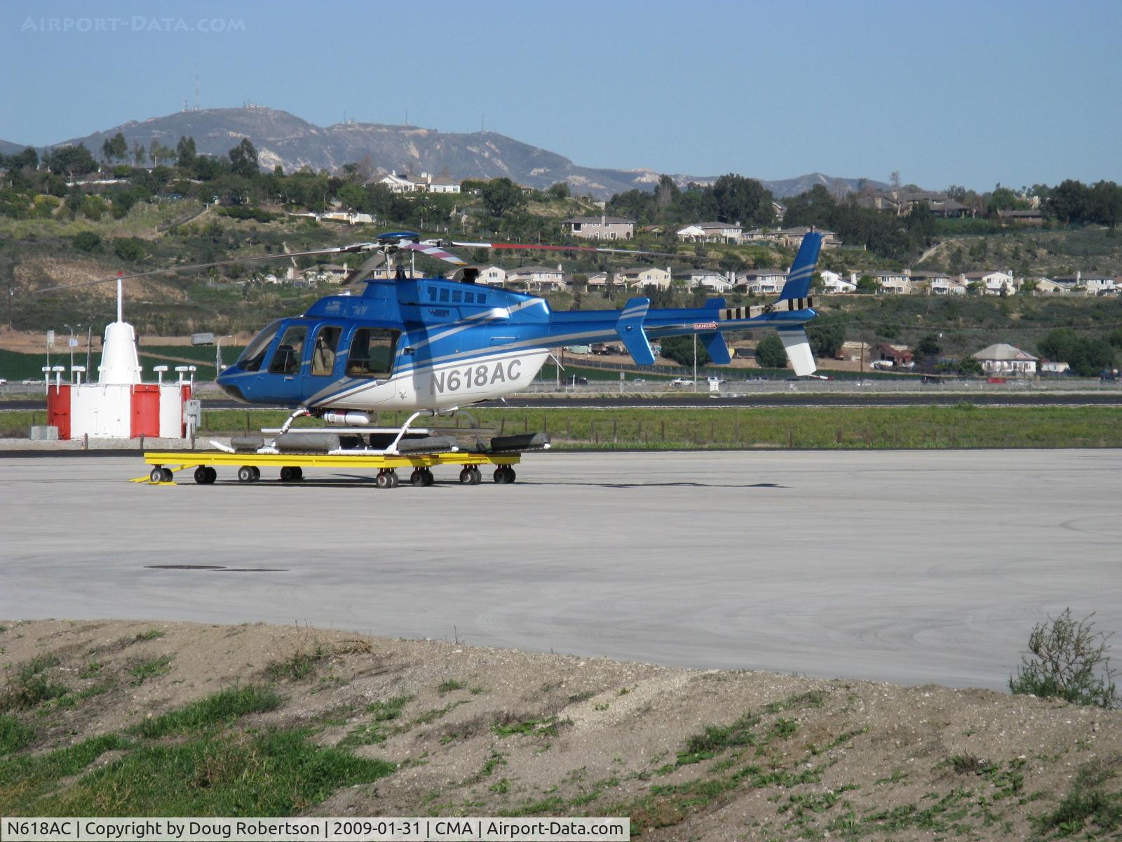 N618AC, 1997 Bell 407 C/N 53153, 1997 Bell 407, one Rolls Royce (Allison) 250-C47 turboshaft with FADEC, 814 shp for takeoff, 700 shp continuous. Up to seven place, 407 utility helicopter is huge sales success. At SUN AIR JETS ramp on dolly.