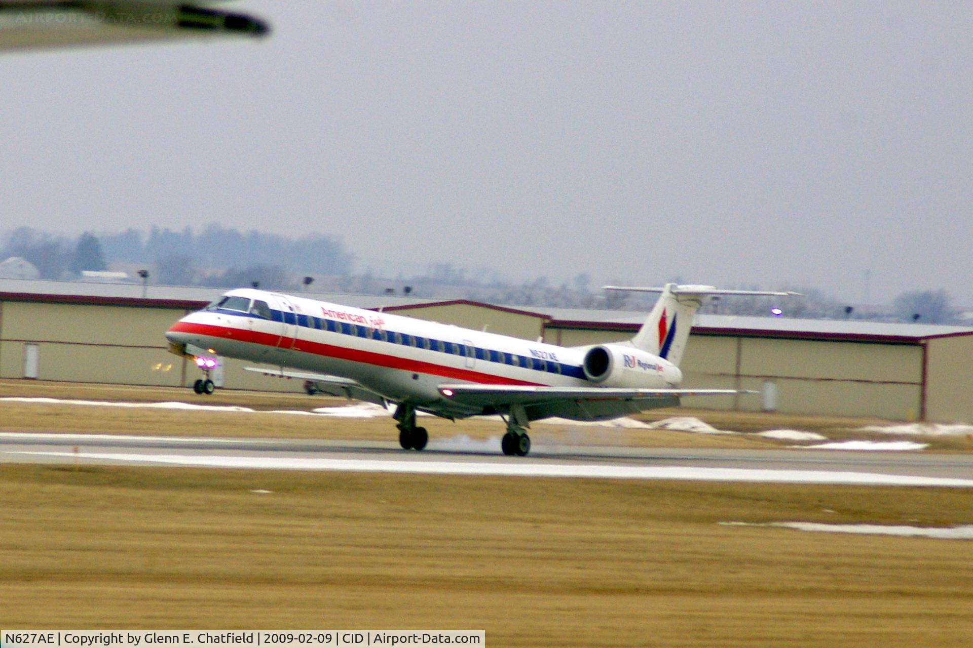 N627AE, 1999 Embraer ERJ-145LR (EMB-145LR) C/N 145121, Touching down on runway 13.  Hazy, and a wee bit blurred shot