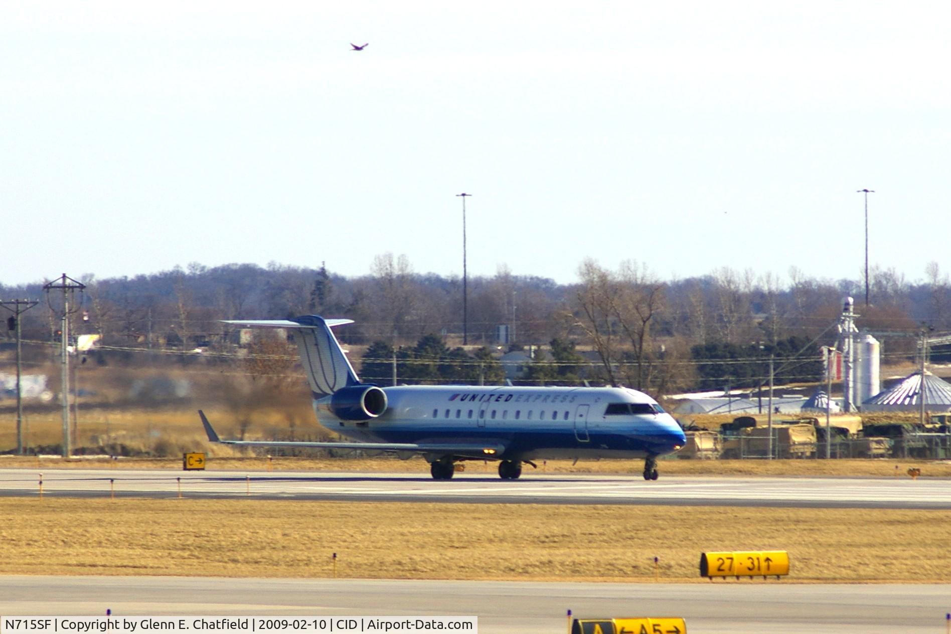 N715SF, 1996 Canadair CRJ-100LR (CL-600-2B19) C/N 7115, Take-off roll on Runway 27, Red Tailed hawk over head