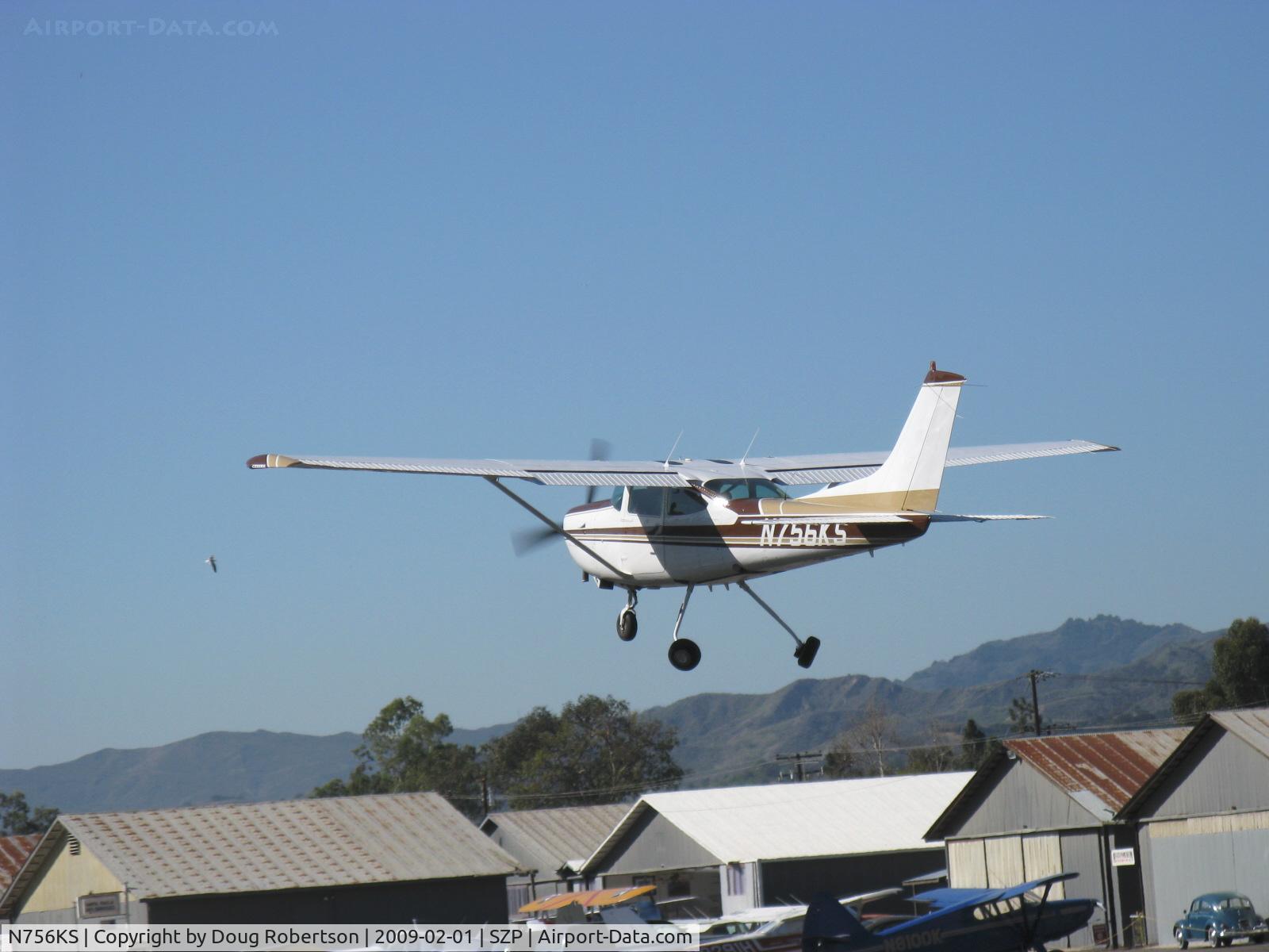 N756KS, 1979 Cessna TR182 Turbo Skylane RG C/N R18201096, 1979 Cessna TR182 SKYLANE, Lycoming O-540-L3C5D 235 Hp, takeoff climb Rwy 22, gear in retraction