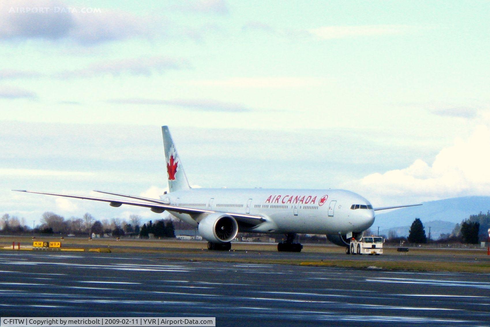 C-FITW, 2007 Boeing 777-333/ER C/N 35298, on the way to the hangar for maintenance