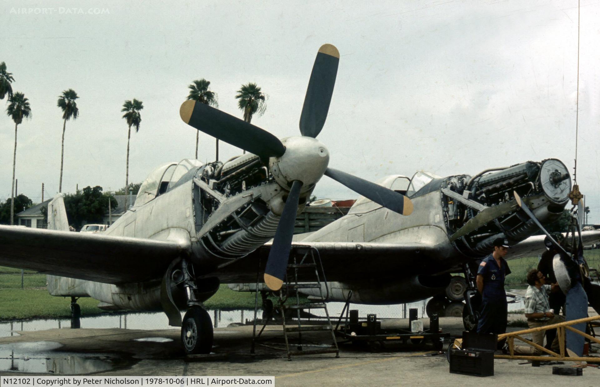 N12102, 1944 North American P-82B C/N 44-65162, Essential maintenance by the Confederate Air Force of their Twin Mustang at the 1978 Airshow.