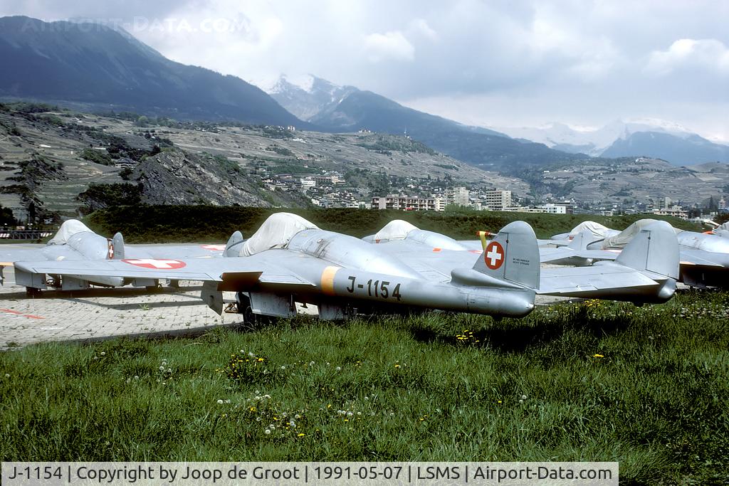 J-1154, De Havilland (FFA) Vampire FB.6 (DH-100) C/N 663, Overview of one of the Vampire storage areas at Sion. This Vampire is now preserved nearby on a pole at the local Seat garage.
