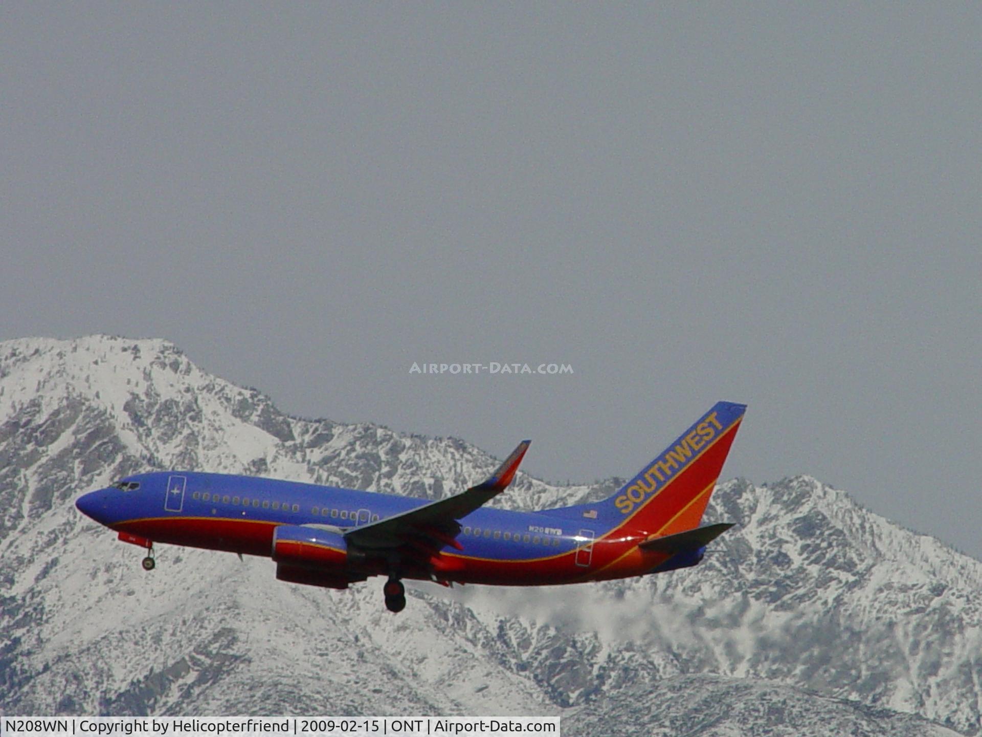 N208WN, 2005 Boeing 737-7H4 C/N 29856, Powering on towards the runway at Ontario, south of our snow