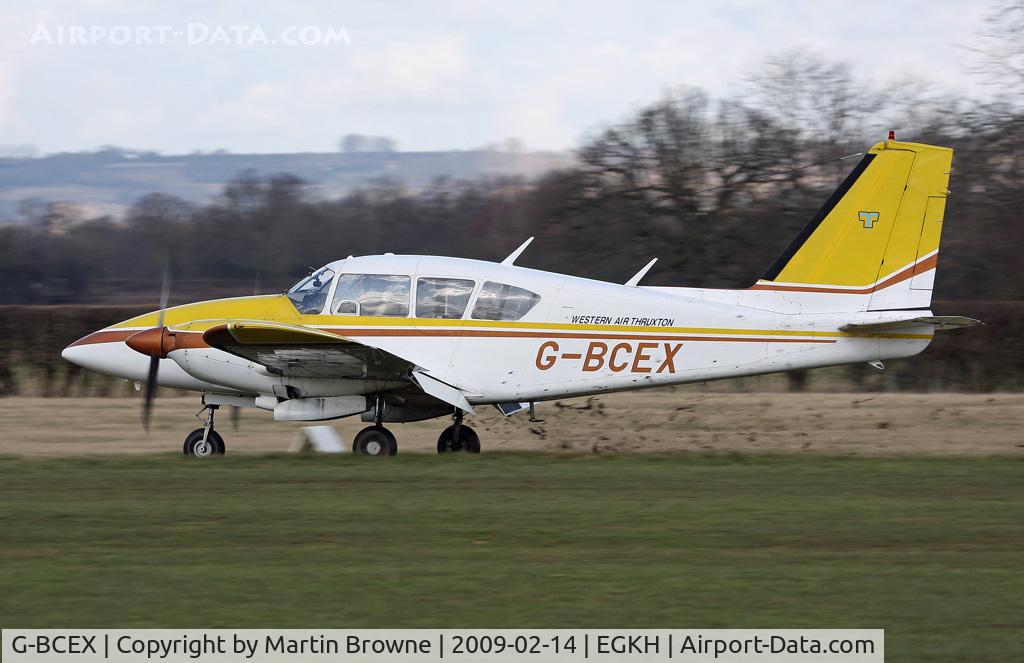 G-BCEX, 1973 Piper PA-E23-250 Aztec C/N 27-7305024, Chucking up dirt as she lands in very wet conditions.