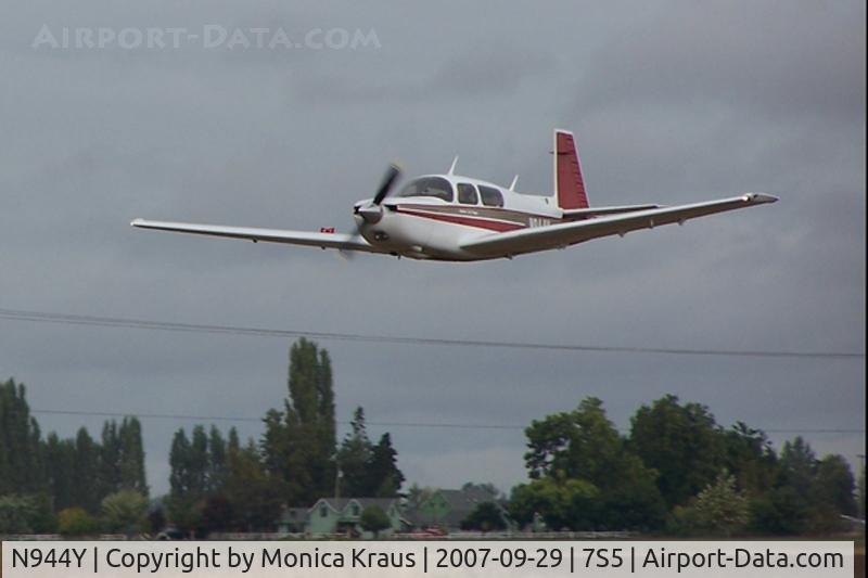 N944Y, 1986 Mooney M20K C/N 25-1077, Pic of me flying low over runway at my house