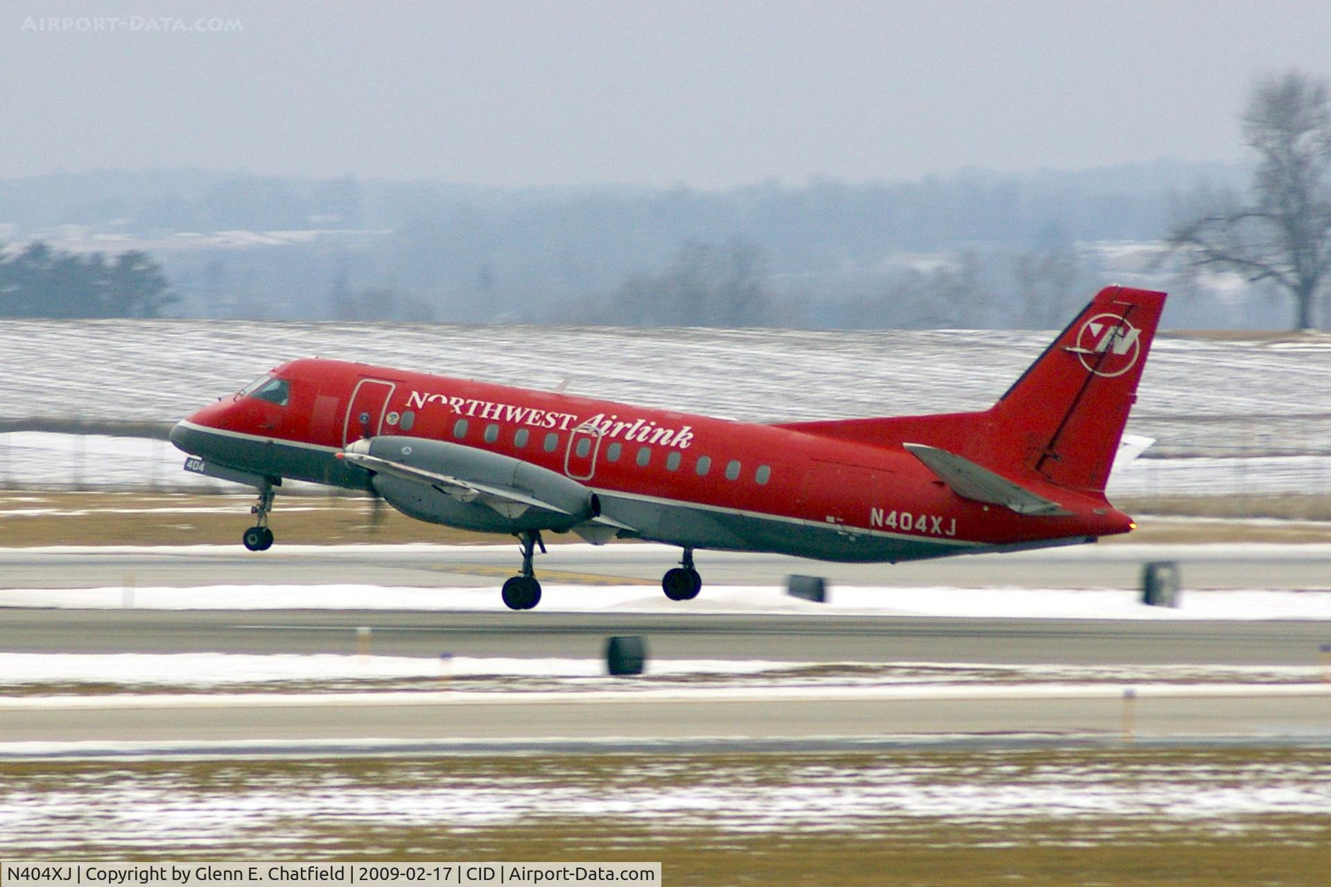 N404XJ, Saab 340B C/N 340B404, Just lifting off  Runway 13, seen from my office window.