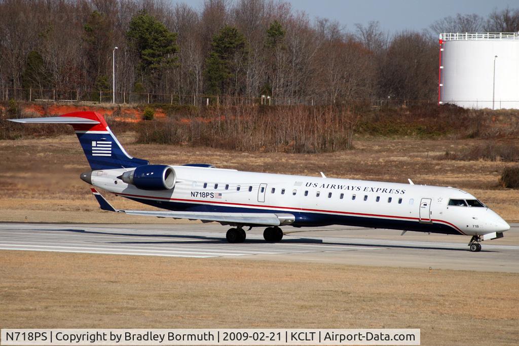 N718PS, 2004 Bombardier CRJ-701 (CL-600-2C10) Regional Jet C/N 10175, Taken from the overlook on the west side of the Charlotte Douglas International Airport.