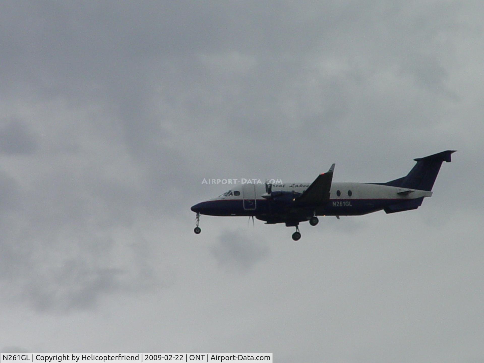 N261GL, 1996 Raytheon Aircraft Company 1900D C/N UE-261, Landing during a gray day at Ontario
