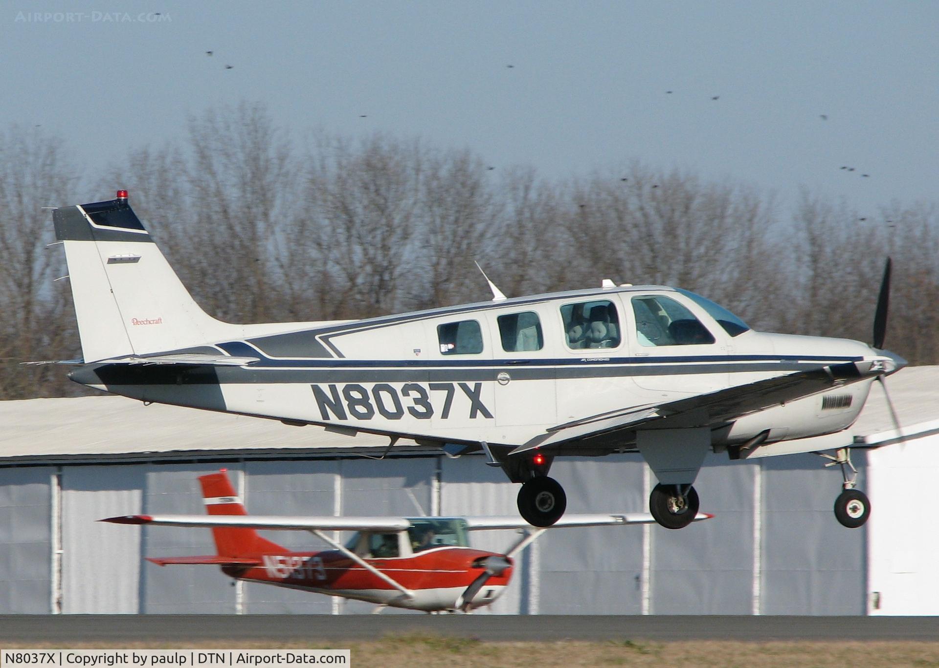 N8037X, Beech A36 Bonanza 36 C/N E-2705, About to touch down on runway 14 at Downtown Shreveport.
