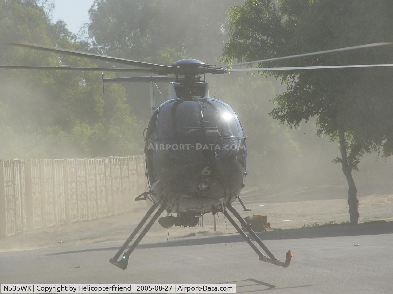 N535WK, MD Helicopters 369FF C/N 0138FF, Kicking up the dirt on touch down
