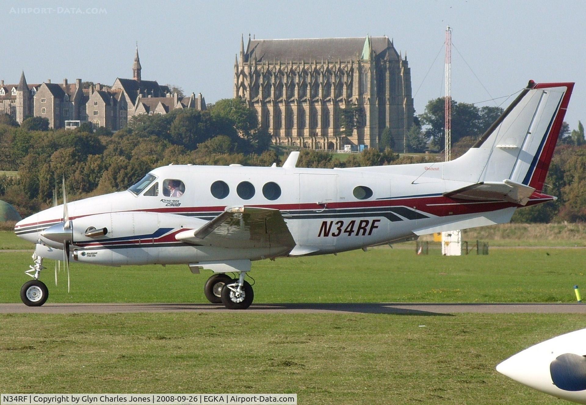 N34RF, 1994 Beech C90B King Air C/N LJ-1371, Taxiing to line up and take off on runway 02. Lancing College makes a great background. Previously VT-PPC. Owned by Roflec Inc.
