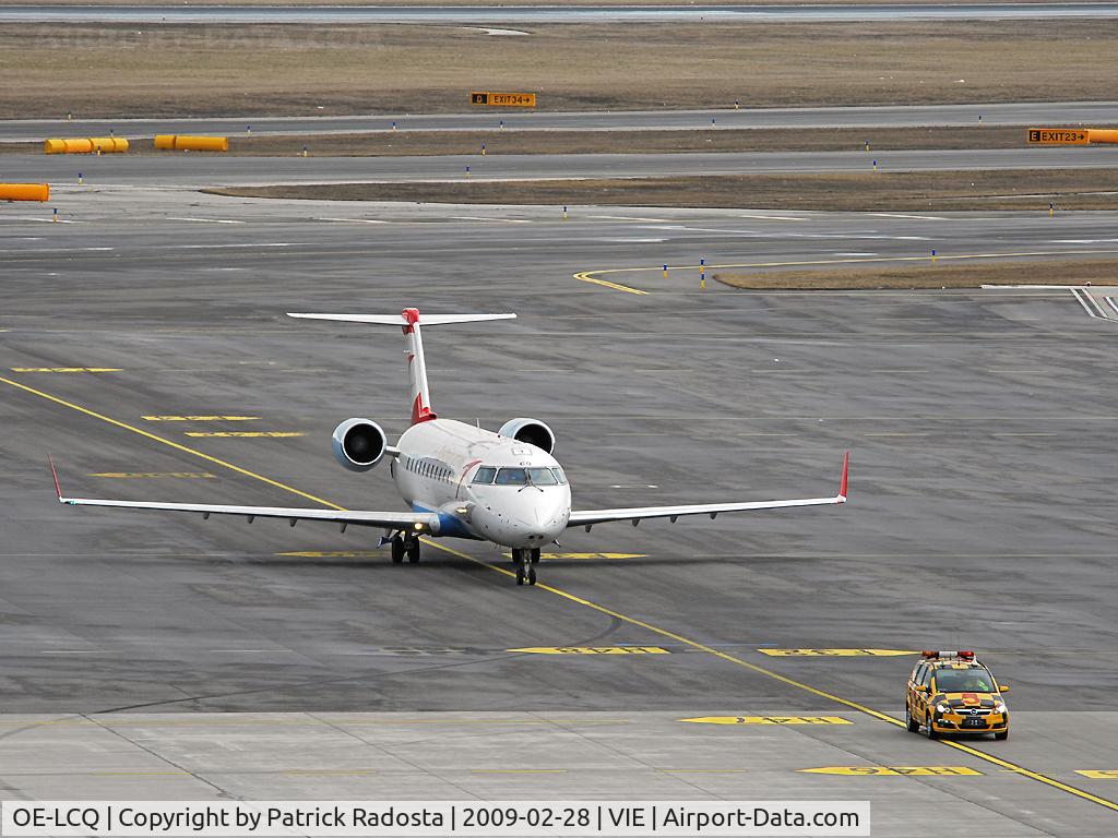 OE-LCQ, 2002 Canadair CRJ-200LR (CL-600-2B19) C/N 7605, Returning from a flight - taxiing to parking position lead by the follow me car