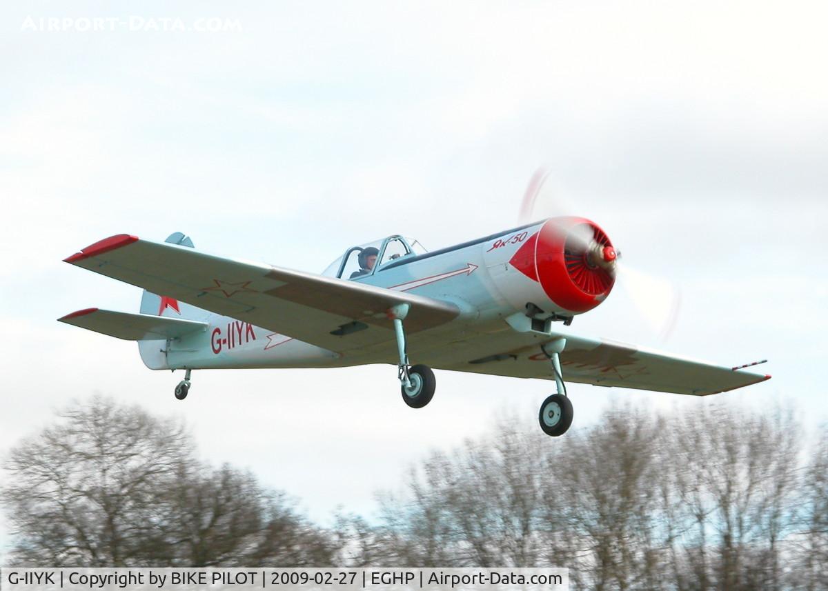 G-IIYK, 1984 Yakovlev Yak-50 C/N 842706, CLIMBING OUT FROM RWY 26 AFTER A VERY SHORT TAKE OFF ROLL. NOTE RE-SKINNING ON WING LEADING EDGES