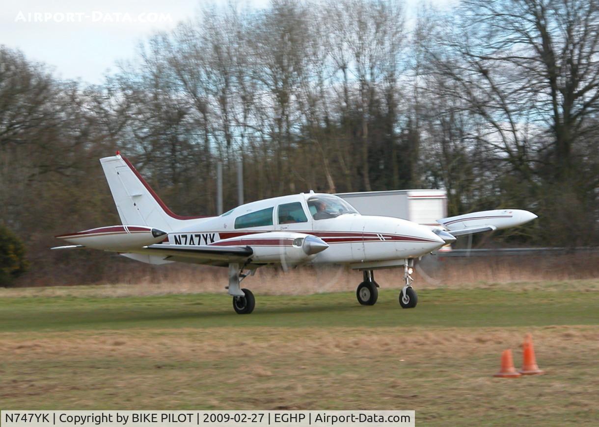 N747YK, 1975 Cessna 310R C/N 310R0138, PICKING UP SPEED ON RWY 26