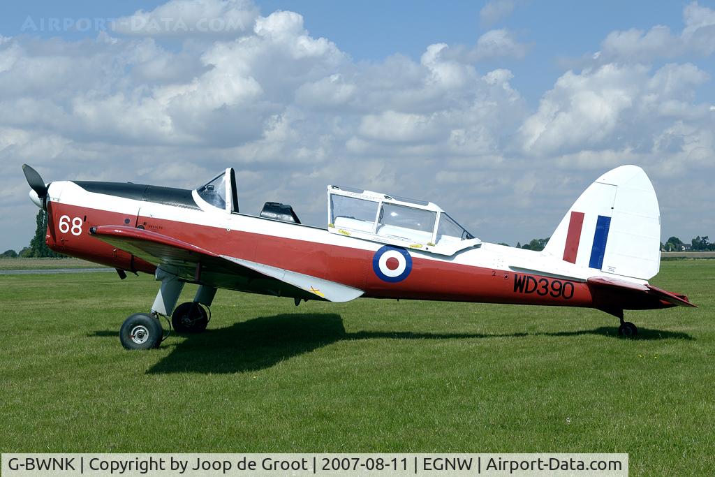 G-BWNK, 1951 De Havilland DHC-1 Chipmunk T.10 C/N C1/0317, Nice warbird resting on the grass in front of the control tower.