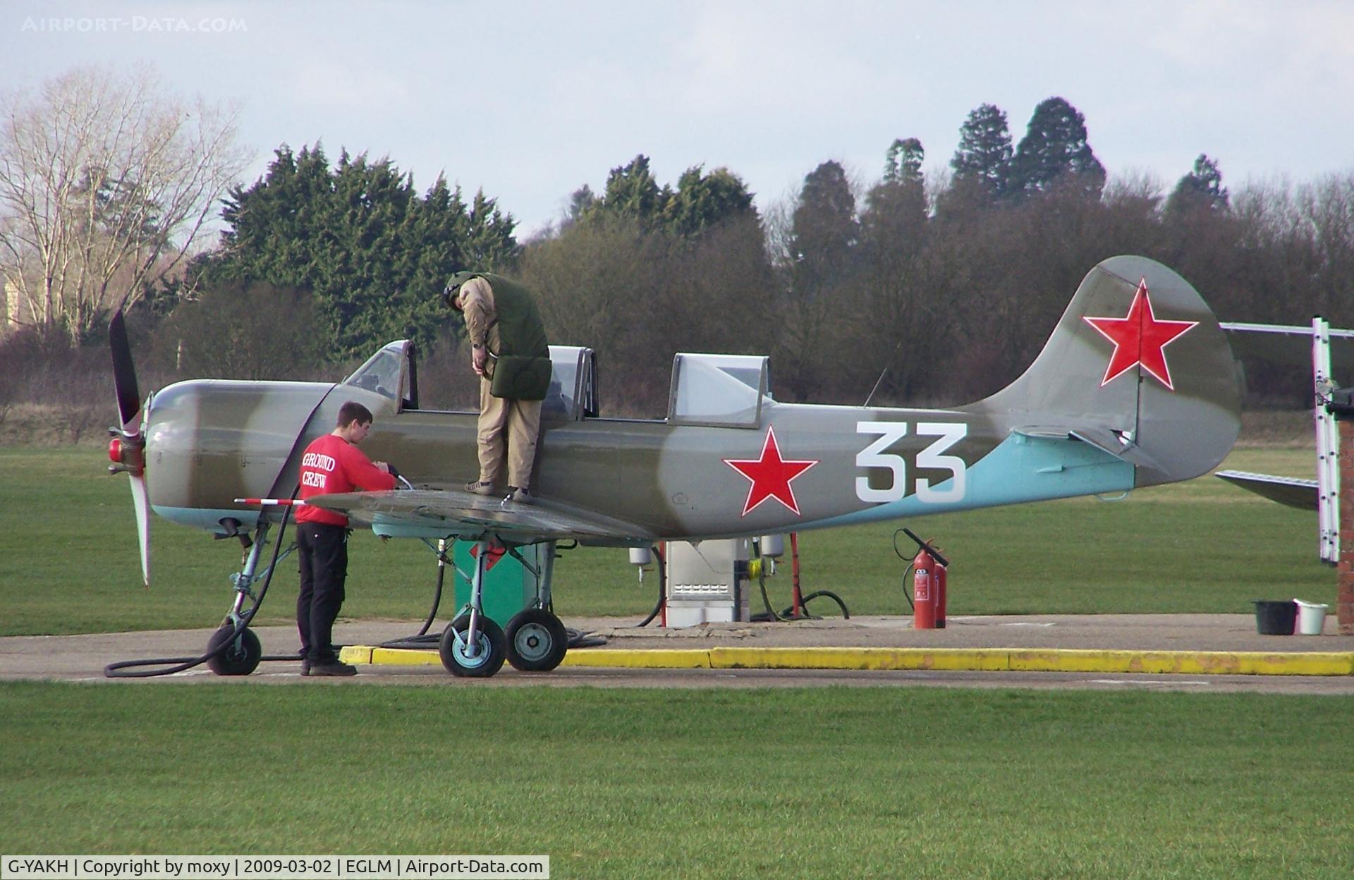 G-YAKH, 1989 Bacau Yak-52 C/N 899915, YAK-52 filling up at White Waltham