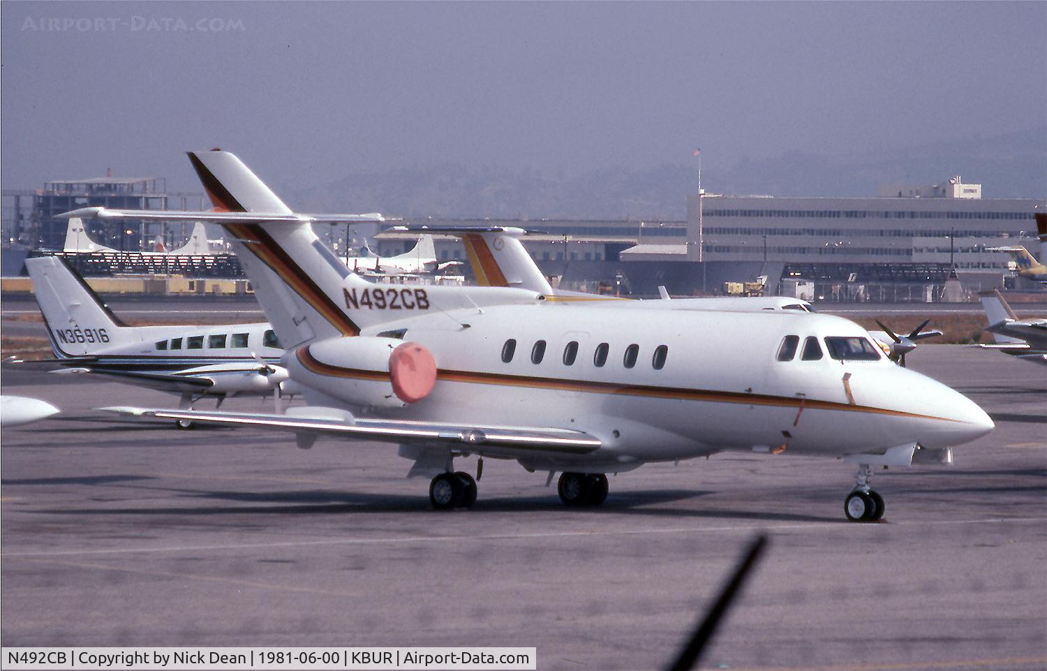 N492CB, 1979 Hawker Siddeley HS125 700A C/N 257056, KBUR (Japanese Navy P-3's prior to delivery on the Lockheed ramp in the background)