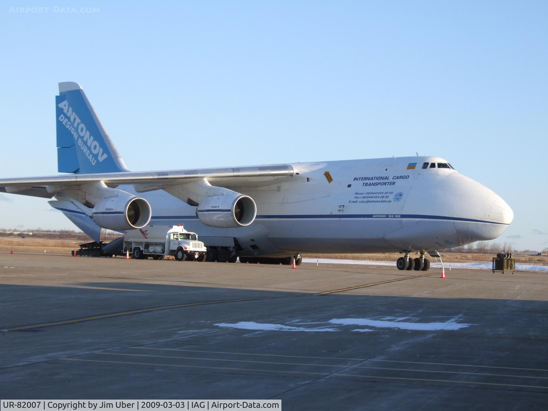 UR-82007, 1988 Antonov An-124-100 Ruslan C/N 19530501005, Something different on the West Ramp (GA portion); Trucks have been depositing cargo on the ramp for a few days, waiting for a 
