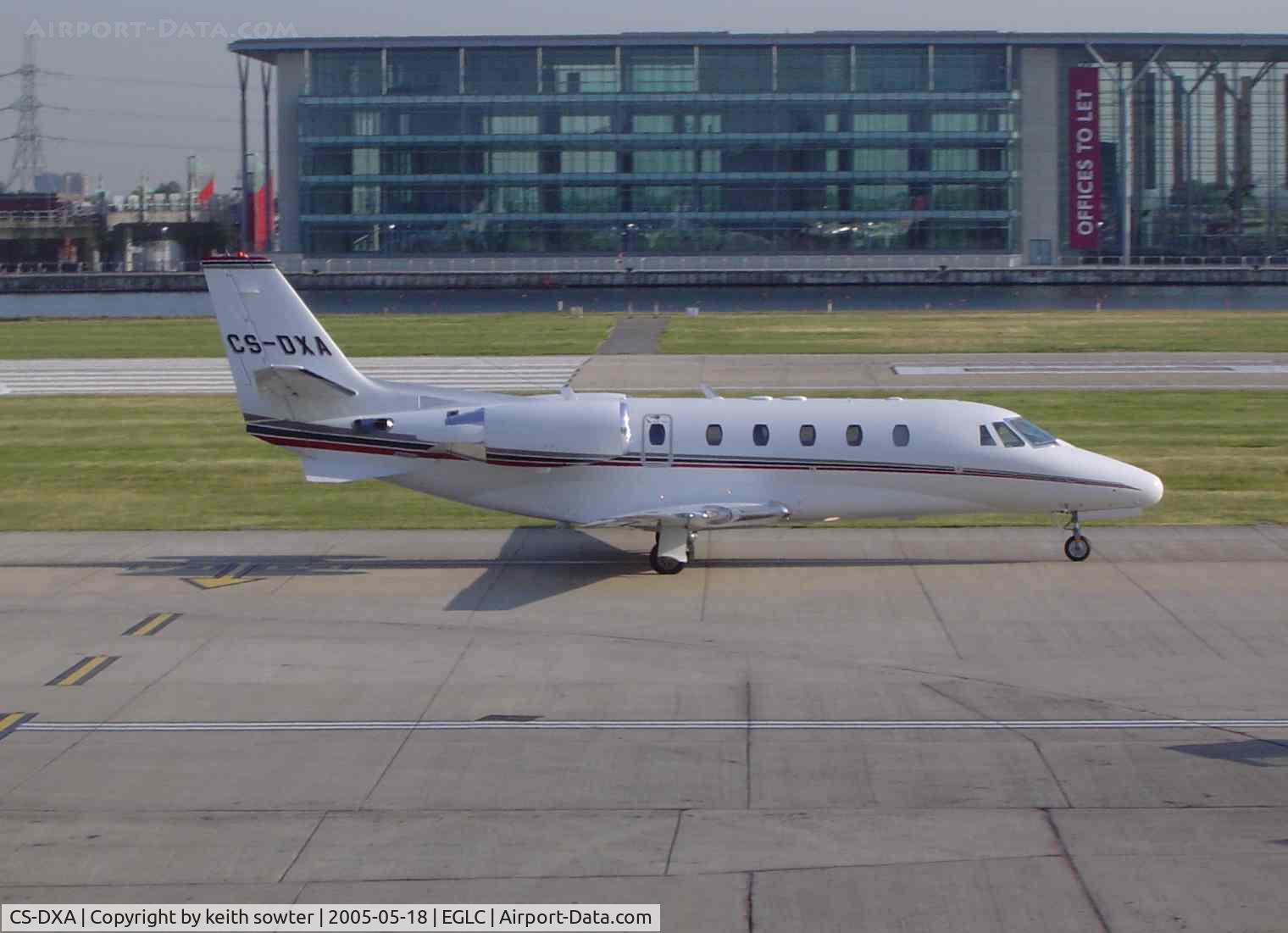 CS-DXA, 2005 Cessna 560XL C/N 560-5549, Taken through glass from the departure lounge