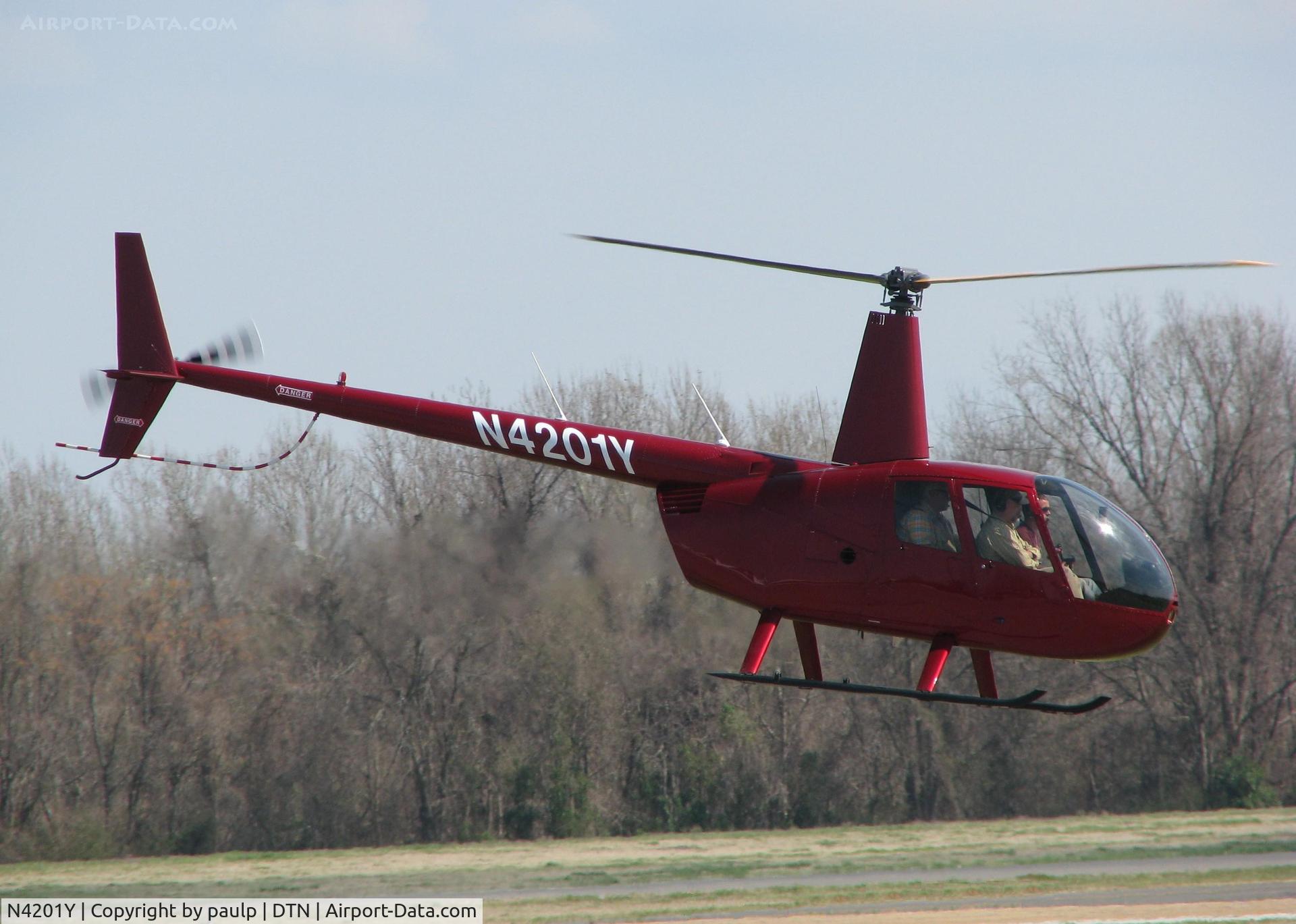 N4201Y, Robinson R44 II C/N 12593, Lifting off from the Shreveport Downtown airport.