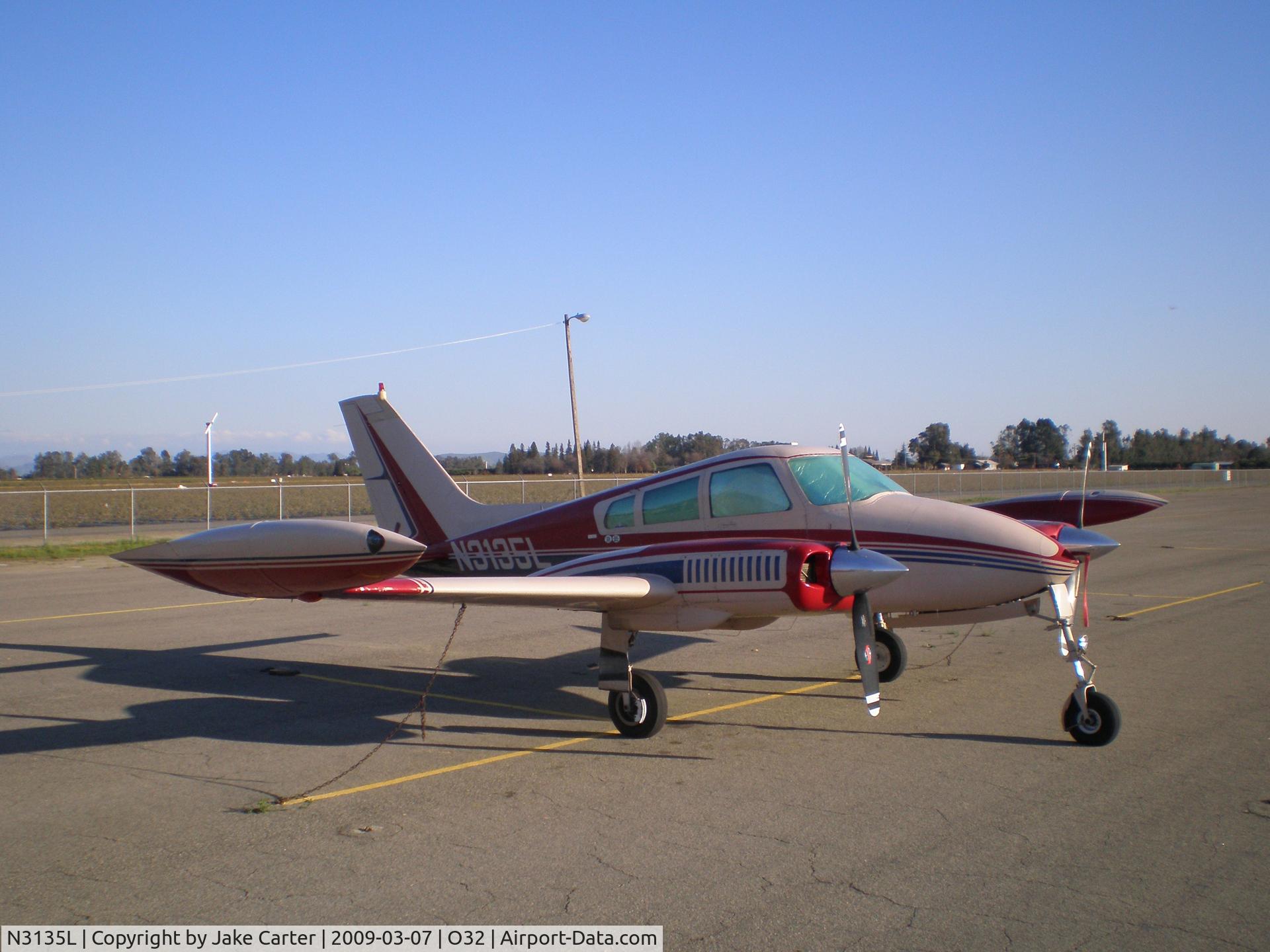 N3135L, 1965 Cessna 310J C/N 310J0135, Parked on transient ramp at Reedley Muni at Reedley, CA