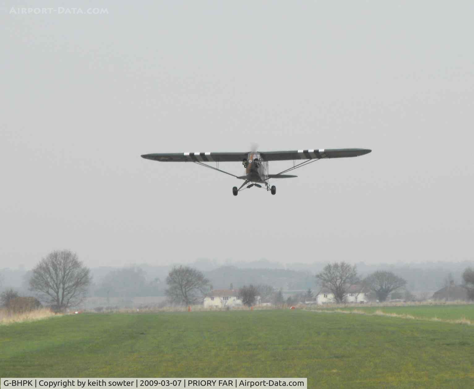 G-BHPK, 1943 Piper L-4H Grasshopper (J3C-65D) C/N 12161, Timeless scene - of Pk leaping into the air off RW01 at its home base of Priory FArm