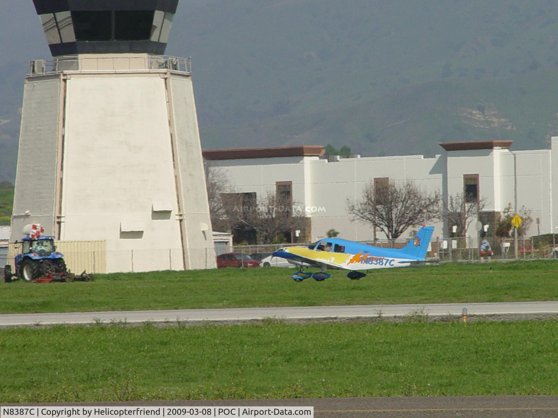N8387C, 1976 Piper PA-28-140 Cherokee C/N 28-7625110, Rolling out westbound 8R past tower and lawn mower