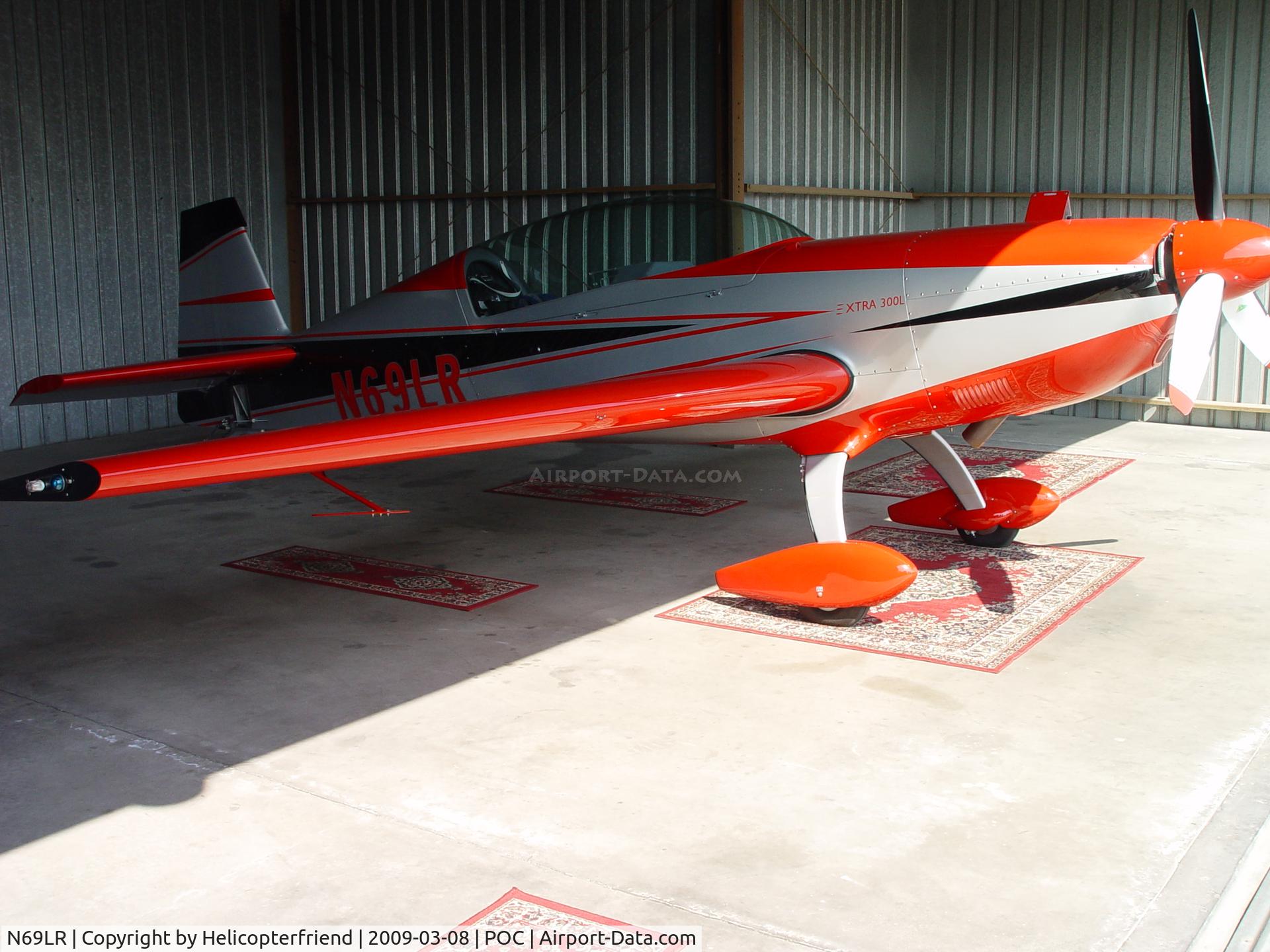N69LR, 2005 Extra EA-300/L C/N 1197, Parked in a hanger after landing to get cleaned up