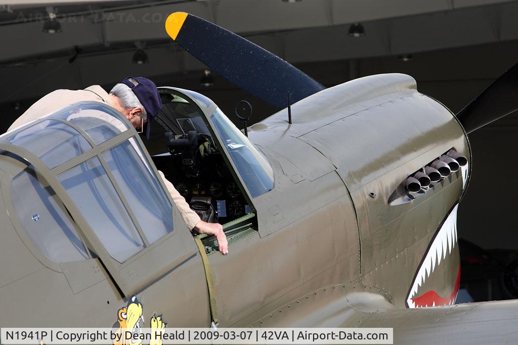 N1941P, 1941 Curtiss P-40E C/N 1025, The pilot of this 1941 Curtiss Wright P-40E is checking out the electrical system, as it was being charged, prior to his flight demonstration.
