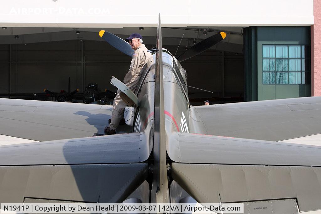 N1941P, 1941 Curtiss P-40E C/N 1025, The pilot of this 1941 Curtiss Wright P-40E Kittyhawk poses for some pictures prior to his demonstration flight.