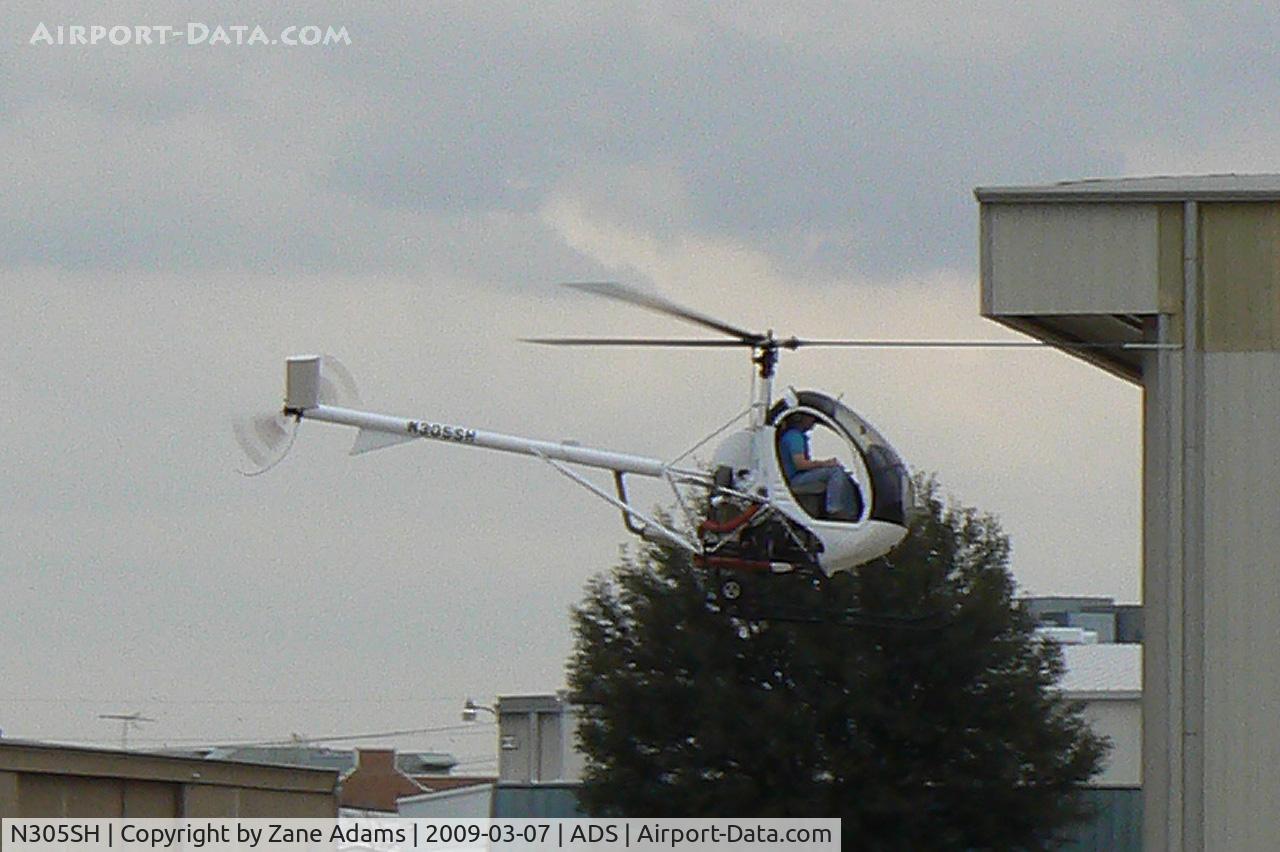 N305SH, 2008 Schweizer 269C-1 C/N 0346, Hughes 269 zipping by the Cavanaugh Flight Museum