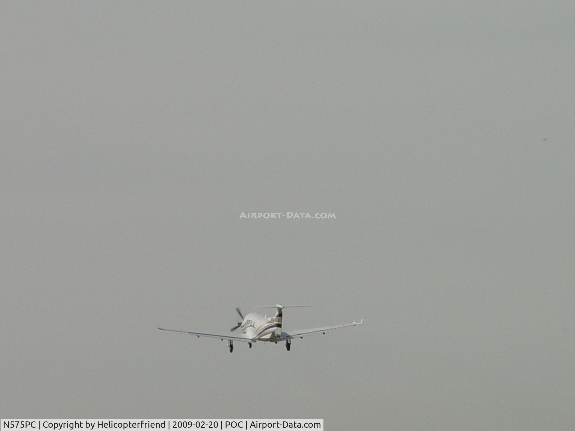N575PC, 2004 Pilatus PC-12/45 C/N 575, Wheels coming up and westbound from Brackett